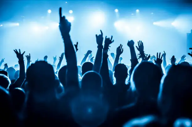 A crowd watching a concert at the Championship Stadium World Tour